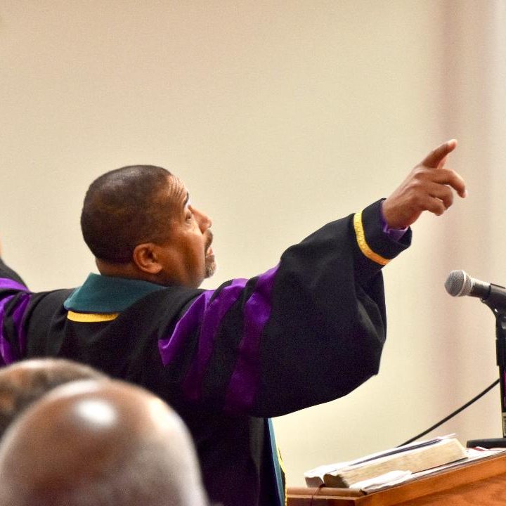 Sr. Bishop Preaching arms spread